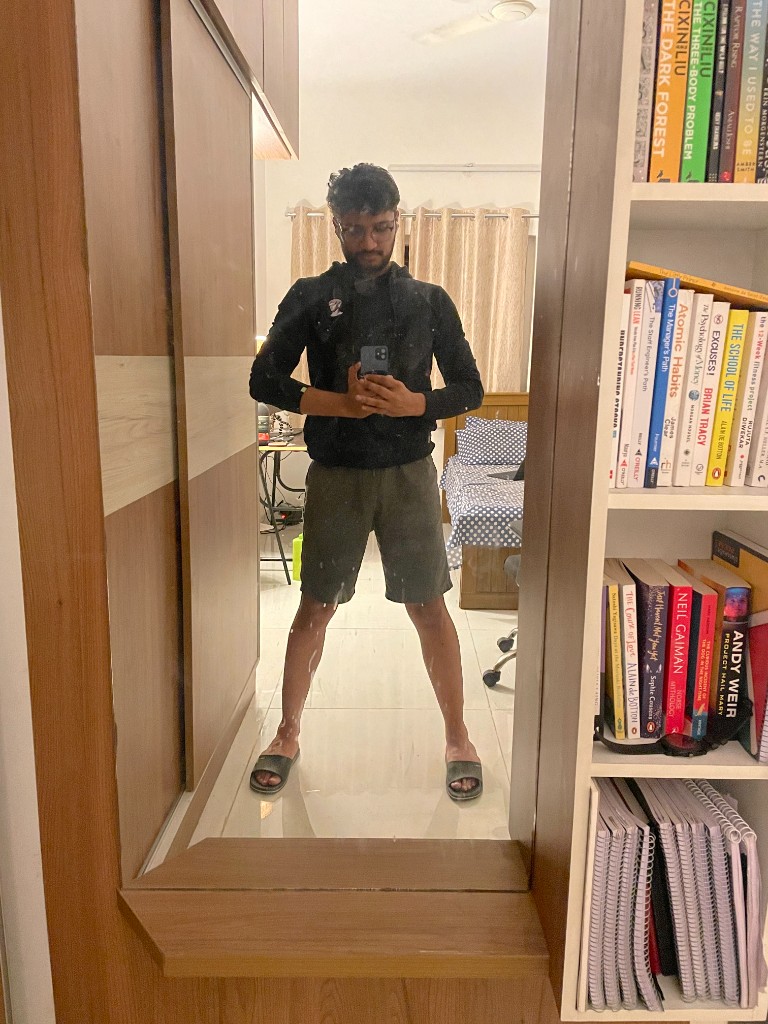 mirror selfie with the bookshelf